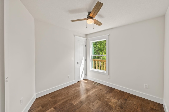 5706 Wilder Rd S, Grimsley, TN 38565 - empty room featuring baseboards, dark wood-type flooring, and a ceiling fan