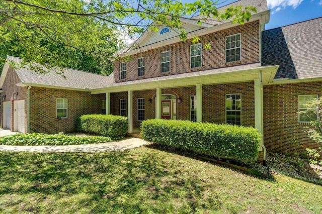 550 Tanya Dr, Whitwell, TN 37397 - view of front of home featuring brick siding, a garage, a front lawn, and a shingled roof