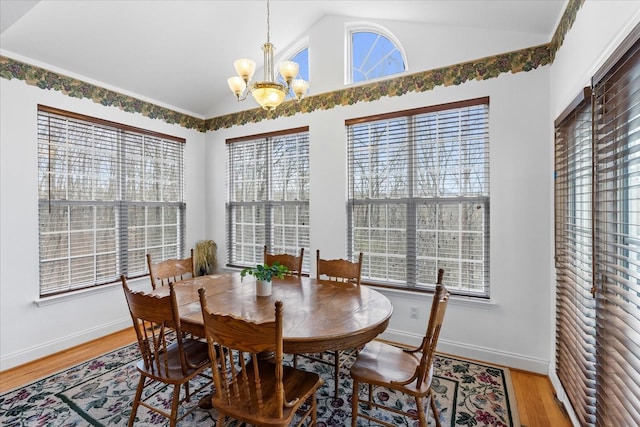 550 Tanya Dr, Whitwell, TN 37397 - dining room featuring a chandelier, vaulted ceiling, light wood finished floors, and baseboards