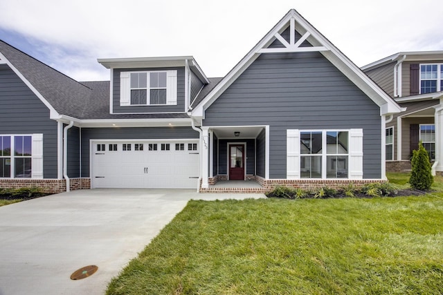 1123 Malinda Ln Unit 64, Greenbrier, TN 37073 - view of front of property featuring driveway, brick siding, a front lawn, a garage, and roof with shingles