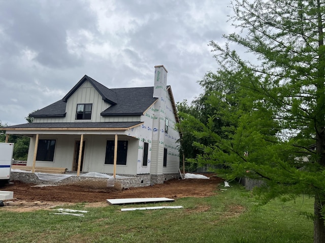 0 Compton Rd, Murfreesboro, TN 37130 - view of front of property featuring board and batten siding, a porch, a chimney, and a shingled roof
