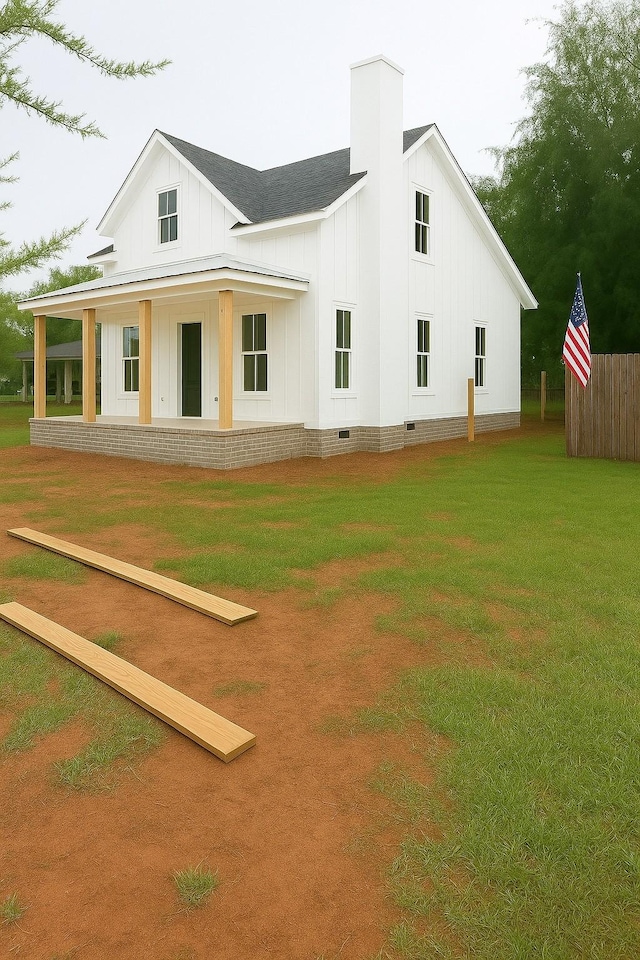 0 Compton Rd, Murfreesboro, TN 37130 - back of property with board and batten siding, crawl space, a lawn, and a chimney