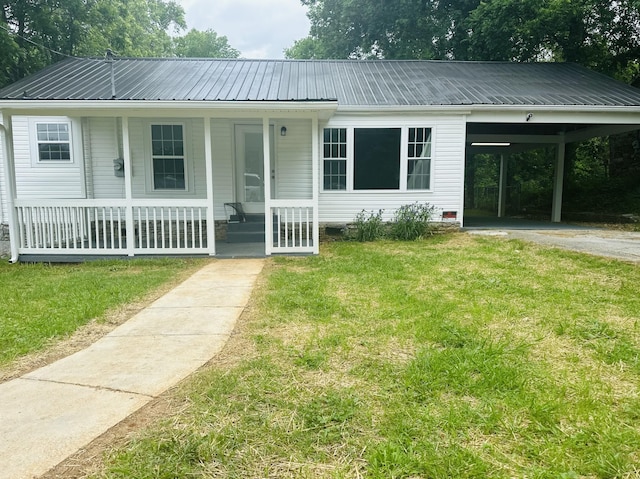 1207 Swanson Blvd, Fayetteville, TN 37334 - view of front of property featuring a porch, a carport, a front yard, and metal roof