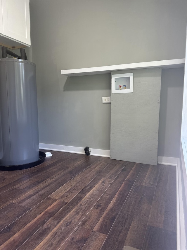 1207 Swanson Blvd, Fayetteville, TN 37334 - washroom featuring cabinet space, water heater, dark wood-type flooring, hookup for a washing machine, and baseboards