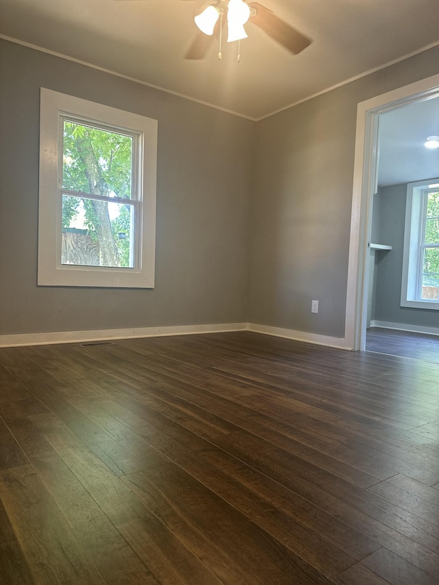 1207 Swanson Blvd, Fayetteville, TN 37334 - empty room with dark wood finished floors, ceiling fan, baseboards, and ornamental molding