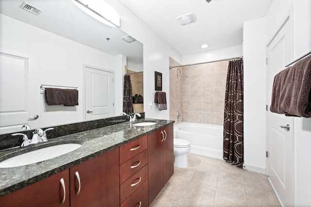 bathroom featuring tile patterned floors, double vanity, toilet, and shower / bath combination with curtain