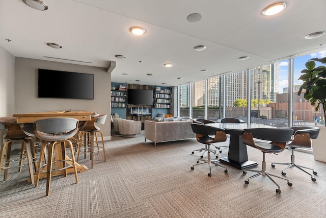 carpeted office space with plenty of natural light, recessed lighting, and baseboards