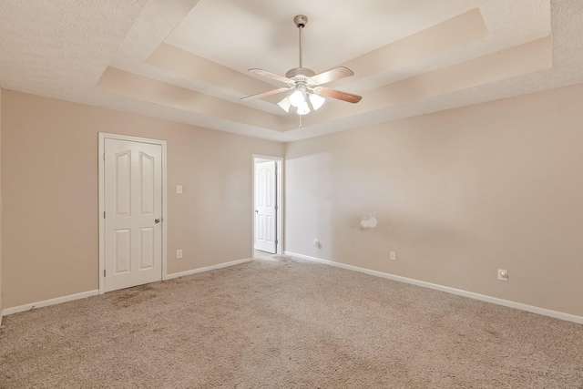 2405 Cason Ln, Lewisburg, TN 37091 - carpeted spare room featuring a tray ceiling, baseboards, and a ceiling fan