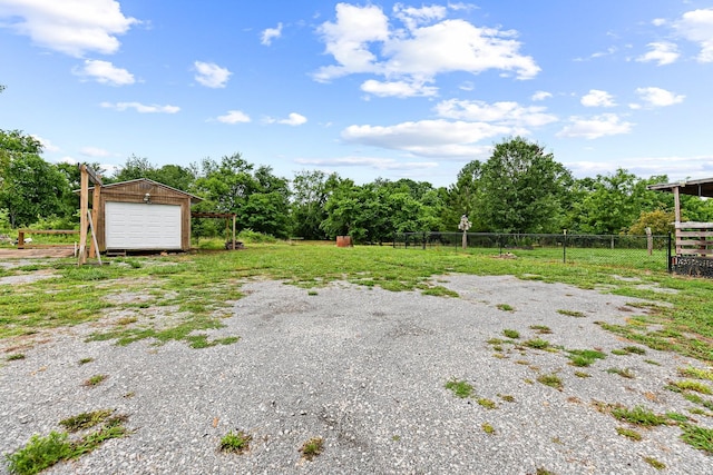 2405 Cason Ln, Lewisburg, TN 37091 - view of yard featuring driveway, an outbuilding, and a garage