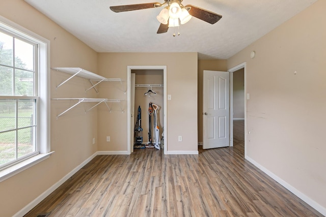 2405 Cason Ln, Lewisburg, TN 37091 - unfurnished bedroom featuring wood finished floors, baseboards, a closet, and a ceiling fan