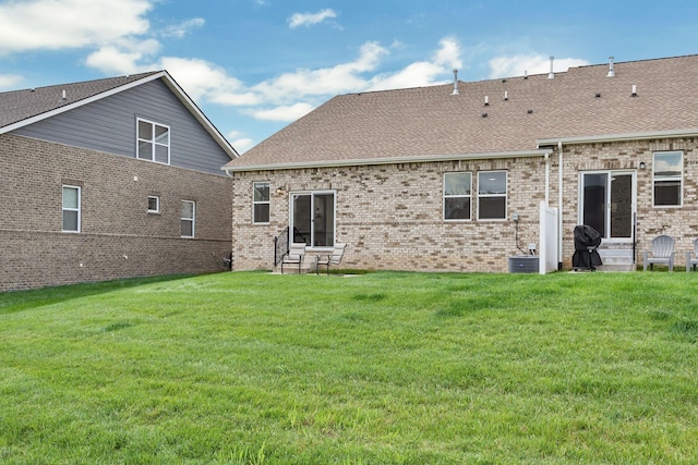 416 Golden Meadow Ln, Hendersonville, TN 37075 - back of property featuring entry steps, roof with shingles, a yard, brick siding, and central air condition unit