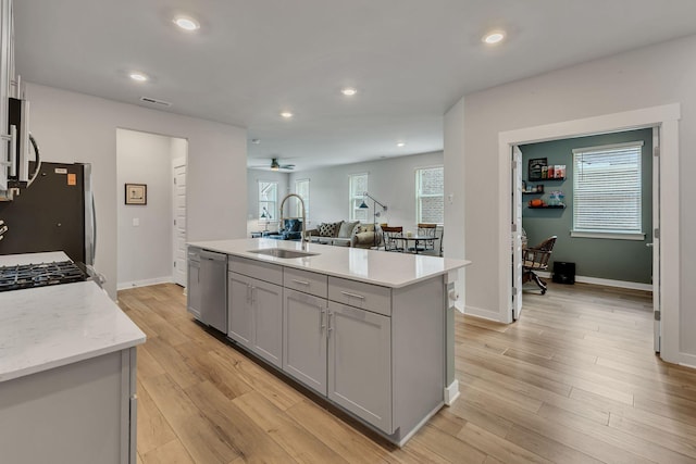 416 Golden Meadow Ln, Hendersonville, TN 37075 - kitchen featuring a sink, gray cabinetry, appliances with stainless steel finishes, a ceiling fan, and light wood-style flooring