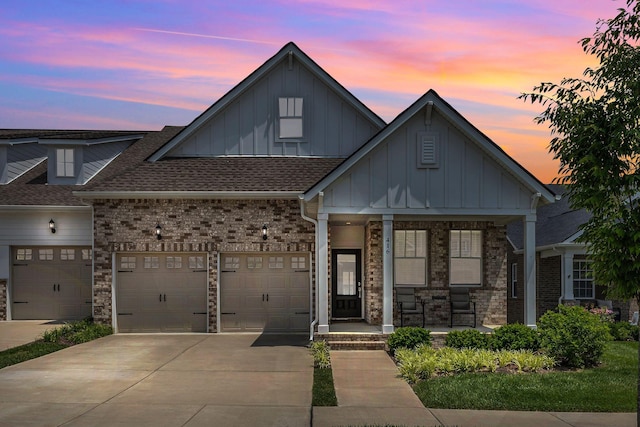 416 Golden Meadow Ln, Hendersonville, TN 37075 - view of front of property with board and batten siding, concrete driveway, a porch, a garage, and roof with shingles