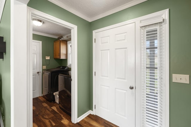 7111 Westview Blvd, Fairview, TN 37062 - foyer entrance with a textured ceiling, independent washer and dryer, dark wood-type flooring, and ornamental molding