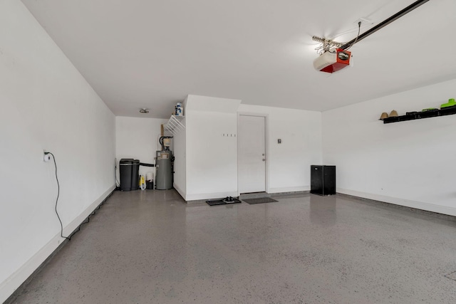580 Laurel Ln, Murfreesboro, TN 37127 - garage featuring a garage door opener, water heater, and baseboards