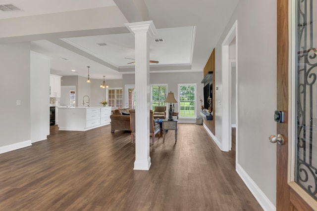 580 Laurel Ln, Murfreesboro, TN 37127 - entrance foyer with a raised ceiling, ceiling fan, dark wood finished floors, baseboards, and decorative columns