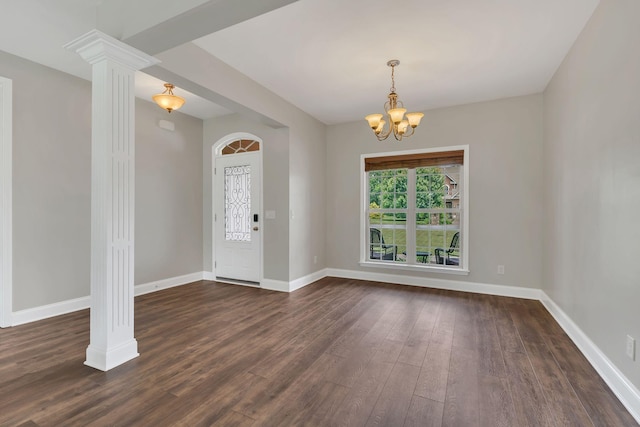580 Laurel Ln, Murfreesboro, TN 37127 - entrance foyer with dark wood-type flooring, a chandelier, baseboards, and ornate columns