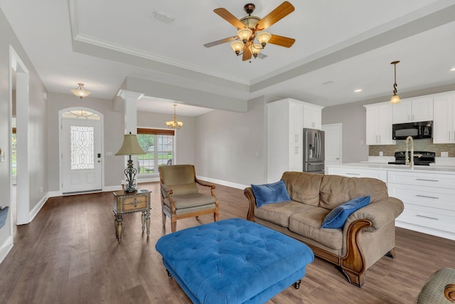 580 Laurel Ln, Murfreesboro, TN 37127 - living room with dark wood-style floors, a chandelier, baseboards, a raised ceiling, and recessed lighting