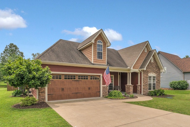 580 Laurel Ln, Murfreesboro, TN 37127 - craftsman-style home with stone siding, a garage, concrete driveway, a front lawn, and roof with shingles