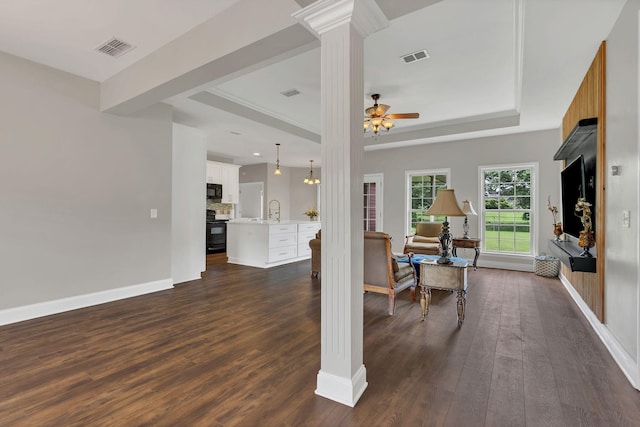 580 Laurel Ln, Murfreesboro, TN 37127 - living area with ornate columns, dark wood-style flooring, a tray ceiling, and ceiling fan