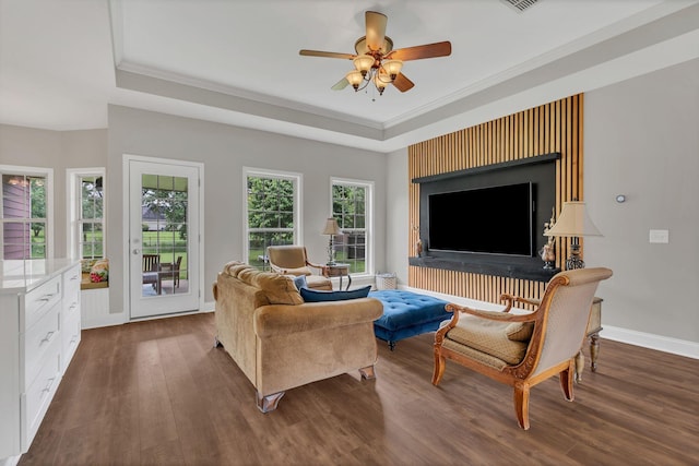 580 Laurel Ln, Murfreesboro, TN 37127 - living area with a tray ceiling, dark wood-style flooring, a ceiling fan, baseboards, and crown molding