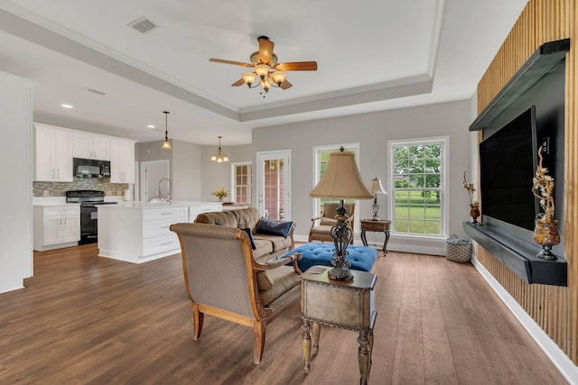 580 Laurel Ln, Murfreesboro, TN 37127 - living room with dark wood finished floors, a tray ceiling, ceiling fan, and recessed lighting