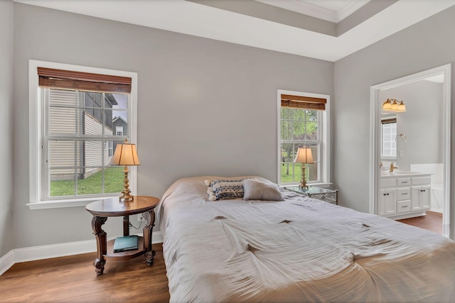 580 Laurel Ln, Murfreesboro, TN 37127 - bedroom with crown molding, wood finished floors, a sink, baseboards, and ensuite bath