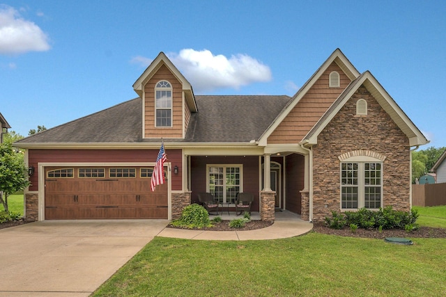 580 Laurel Ln, Murfreesboro, TN 37127 - view of front of property featuring stone siding, an attached garage, a front lawn, and concrete driveway