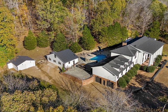 view of subject property featuring a forest