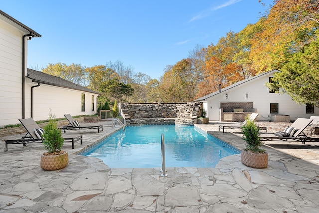 swimming pool featuring a patio area