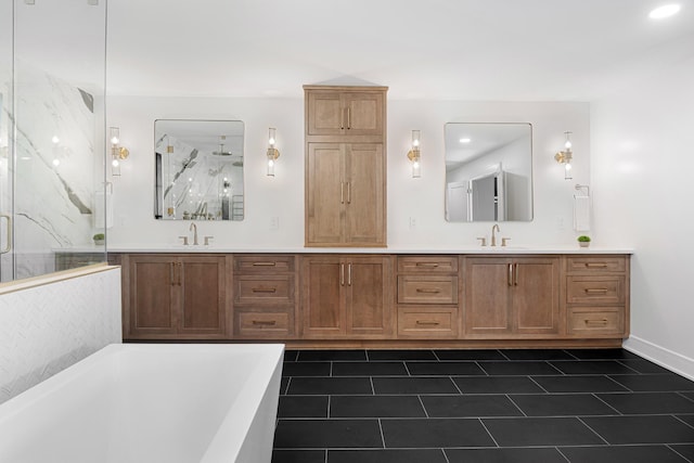 full bathroom featuring a marble finish shower, double vanity, a freestanding tub, tile patterned flooring, and recessed lighting