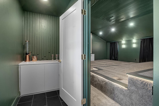 bedroom featuring dark tile patterned flooring, dark carpet, and recessed lighting