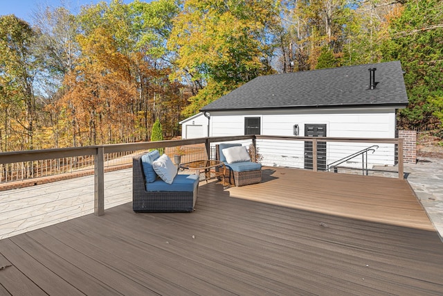 wooden terrace with an outbuilding