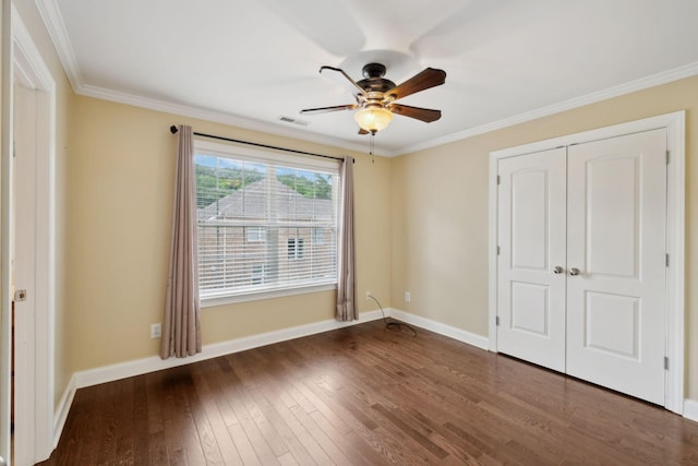 1769 Mayflower Dr, Columbia, TN 38401 - unfurnished bedroom featuring baseboards, dark wood-type flooring, ornamental molding, a closet, and ceiling fan