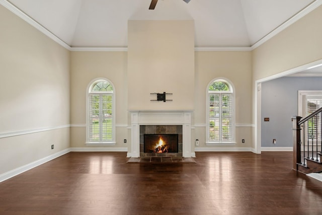 1769 Mayflower Dr, Columbia, TN 38401 - unfurnished living room featuring high vaulted ceiling, plenty of natural light, stairs, wood finished floors, and a fireplace