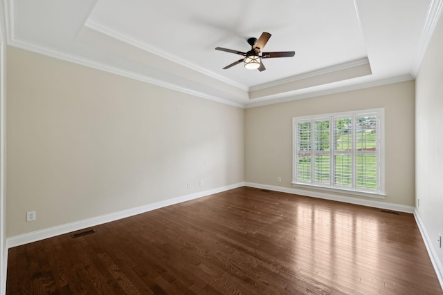 1769 Mayflower Dr, Columbia, TN 38401 - spare room featuring a tray ceiling, ceiling fan, dark wood-style floors, ornamental molding, and baseboards