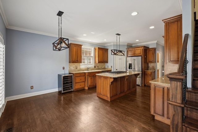 1769 Mayflower Dr, Columbia, TN 38401 - kitchen featuring wine cooler, stainless steel appliances, brown cabinets, a sink, and a kitchen island