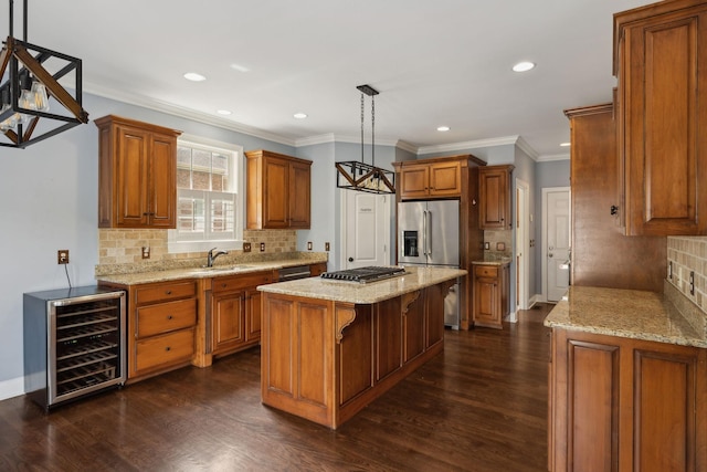 1769 Mayflower Dr, Columbia, TN 38401 - kitchen with beverage cooler, brown cabinetry, a center island, recessed lighting, and ornamental molding