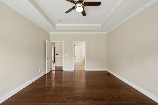 1769 Mayflower Dr, Columbia, TN 38401 - spare room with a raised ceiling, wood finished floors, ceiling fan, ornamental molding, and baseboards
