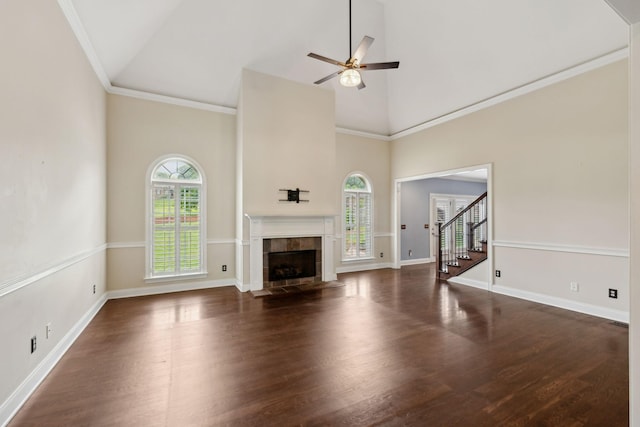 1769 Mayflower Dr, Columbia, TN 38401 - unfurnished living room featuring high vaulted ceiling, wood finished floors, ceiling fan, stairway, and a tile fireplace