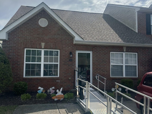 1040 Charlie Daniels Pkwy Unit 105, Mount Juliet, TN 37122 - view of front of house featuring brick siding and roof with shingles