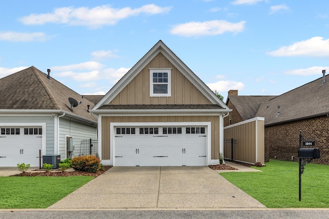 2044 Mainstream Dr, Franklin, TN 37064 - view of front of house with board and batten siding, a garage, a front yard, and central AC