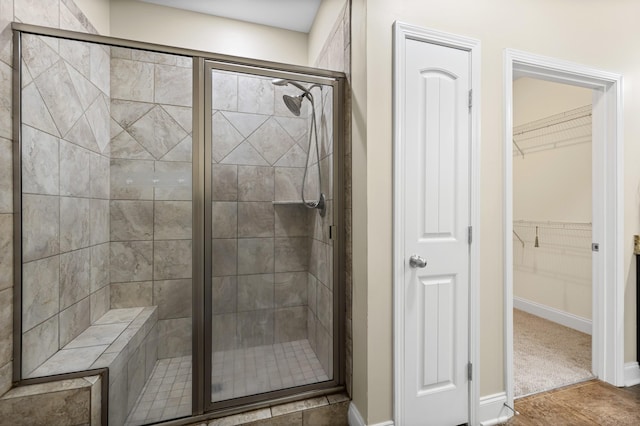 2044 Mainstream Dr, Franklin, TN 37064 - bathroom with a shower stall, baseboards, and a walk in closet