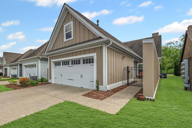 2044 Mainstream Dr, Franklin, TN 37064 - view of front facade with board and batten siding, concrete driveway, cooling unit, a front yard, and a garage