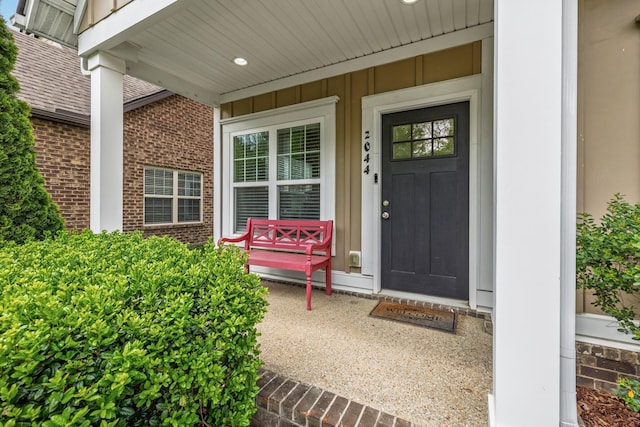 2044 Mainstream Dr, Franklin, TN 37064 - property entrance featuring brick siding, a porch, and board and batten siding