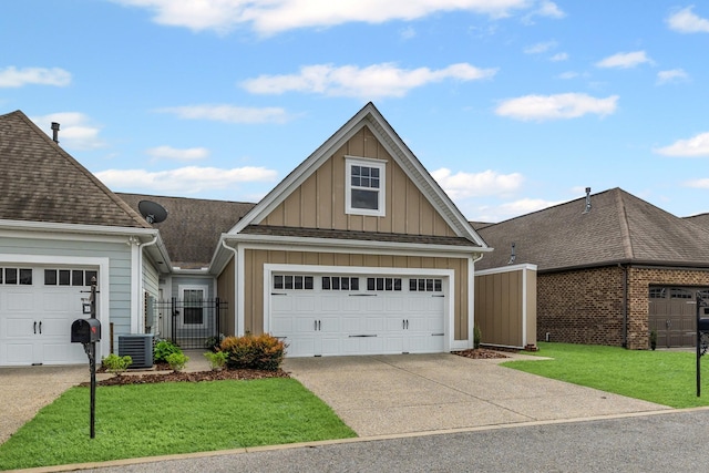 2044 Mainstream Dr, Franklin, TN 37064 - view of front of house with board and batten siding, a garage, a gate, driveway, and central air condition unit