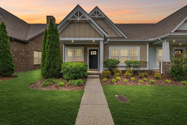 2044 Mainstream Dr, Franklin, TN 37064 - craftsman-style home featuring board and batten siding, a shingled roof, a yard, and a chimney