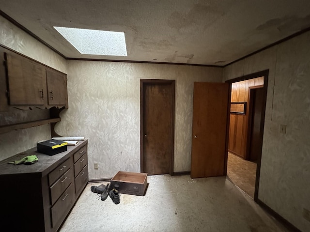120 Red Bell Rd, Newbern, TN 38059 - kitchen with a skylight, baseboards, and dark brown cabinetry