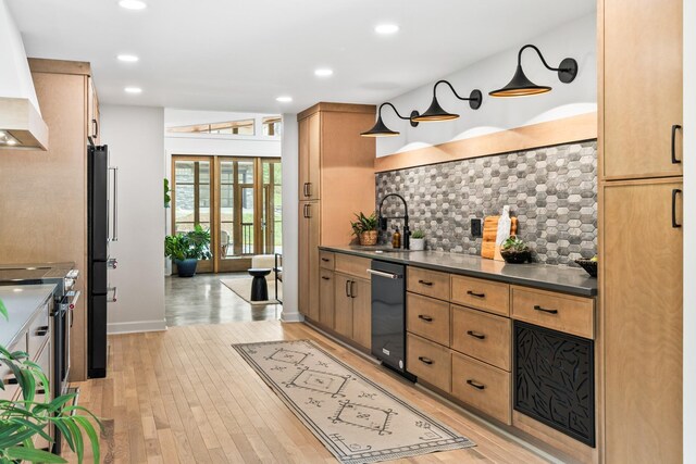 2013 Hackberry Ln, Nashville, TN 37206 - kitchen with a sink, black appliances, decorative backsplash, light wood-style flooring, and recessed lighting