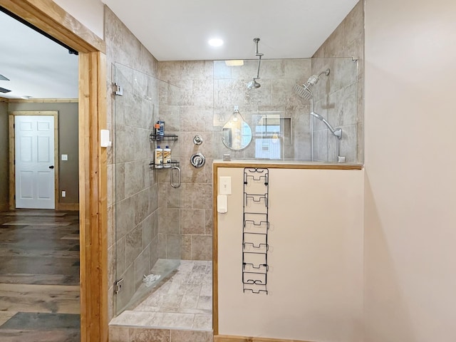 full bath featuring a walk in shower and wood finished floors
